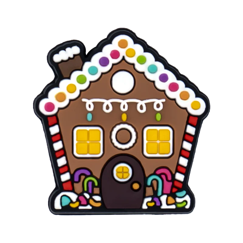 Shoe charm ornament of Gingerbread house-shaped cookie with colorful decorations on a white background