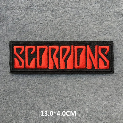 Embroidered patch with 'SCORPIONS' text in red on a gray background