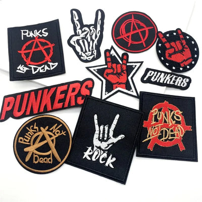 Collection of punk-themed patches with symbols and text on a white background