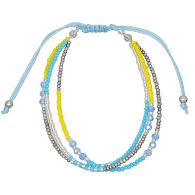 Multistrand beaded bracelet with blue, yellow, and silver beads on a white background