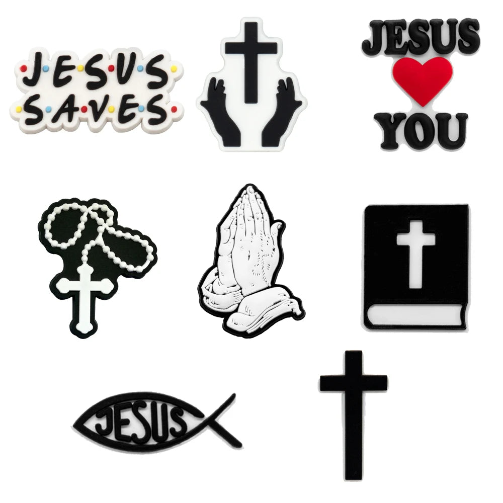 Set of religious-themed shoe charms including 'Jesus Saves', cross, praying hands, Bible, fish symbol, and 'Jesus Loves You' with a heart.