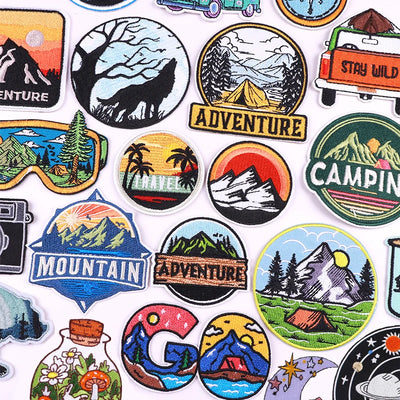 Collection of various outdoor-themed stickers on a white background