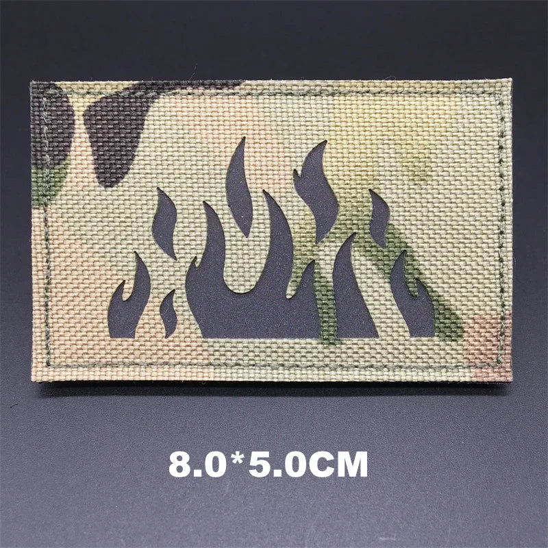 Camouflage patch with flame design on a dark background