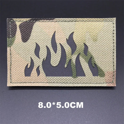 Camouflage patch with flame design on a dark background