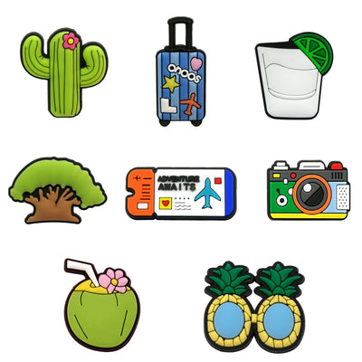 Set of colorful travel-themed shoe charms on a white background