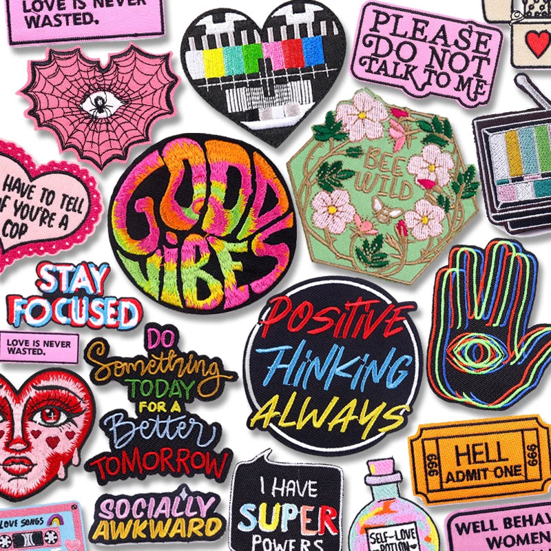 Collection of colorful patches with various designs and text