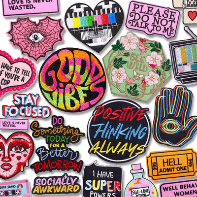 Collection of colorful patches with various designs and text