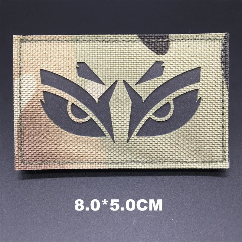 Textile patch with eye design on a dark background