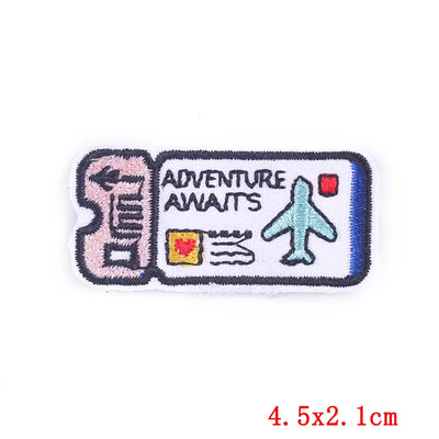 Embroidered patch with 'Adventure Awaits' text and airplane icon on a white background