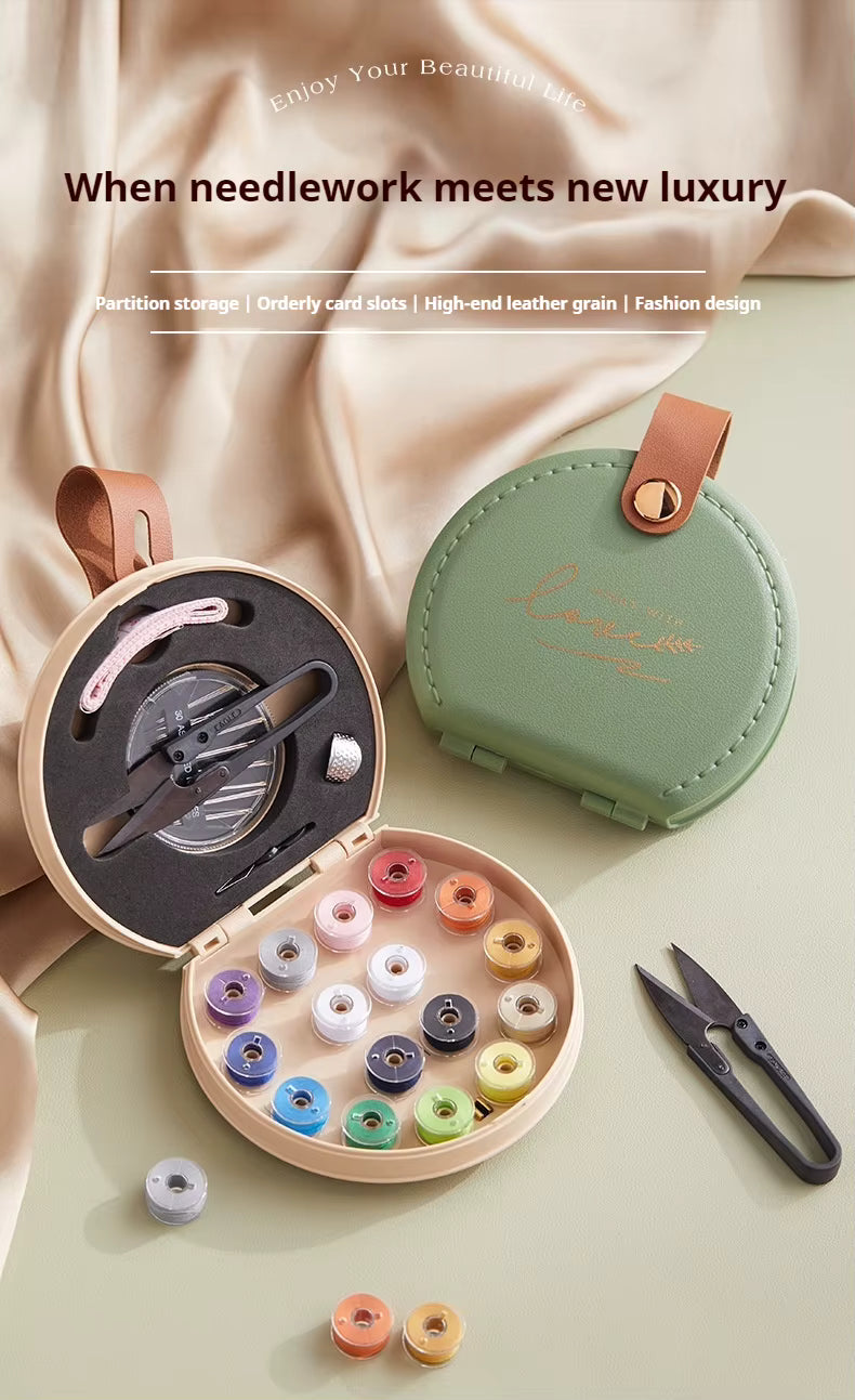 Luxury round sewing kit box with colorful thread spools, needles, scissors and sewing accessories
