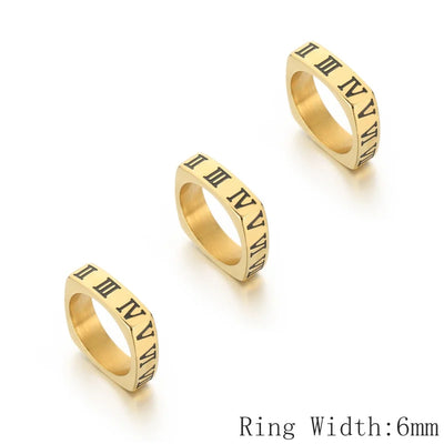 Three gold rings with Roman numeral design on a white background