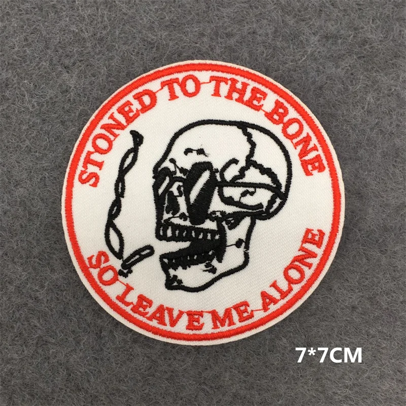 Circular patch with skull design and text 'Stoned to the bone so leave me alone' on a gray background.