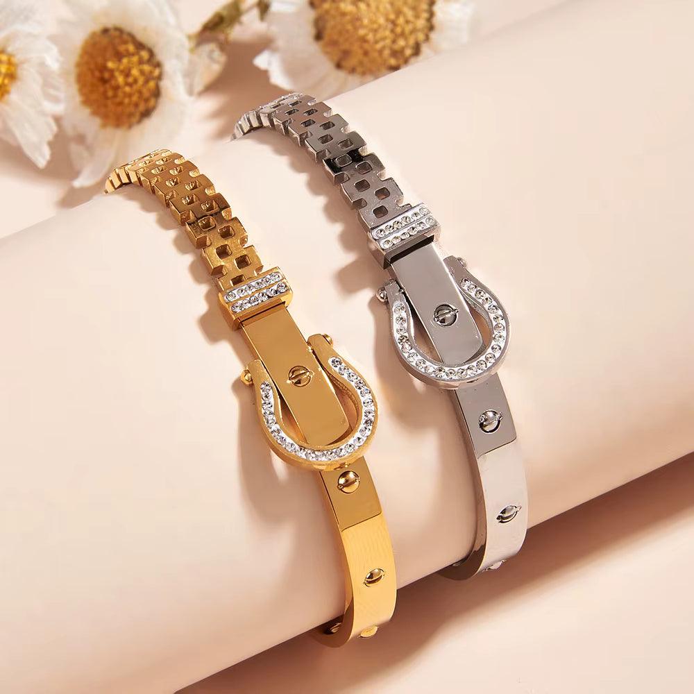 Gold and silver bracelets with floral background