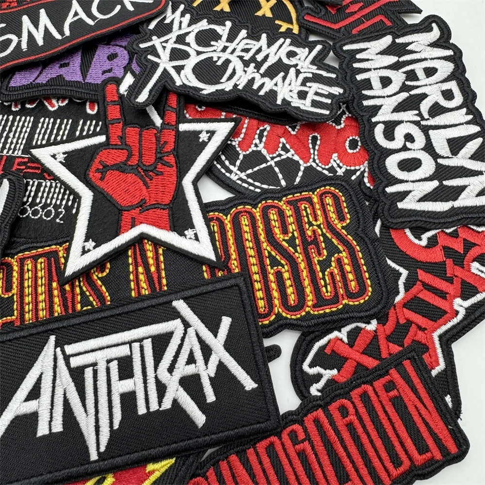 Collection of various band patches including Anthrax, Marilyn Manson, and Chemical Brothers.