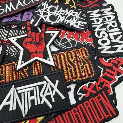 Collection of various band patches including Anthrax, Marilyn Manson, and Chemical Brothers.