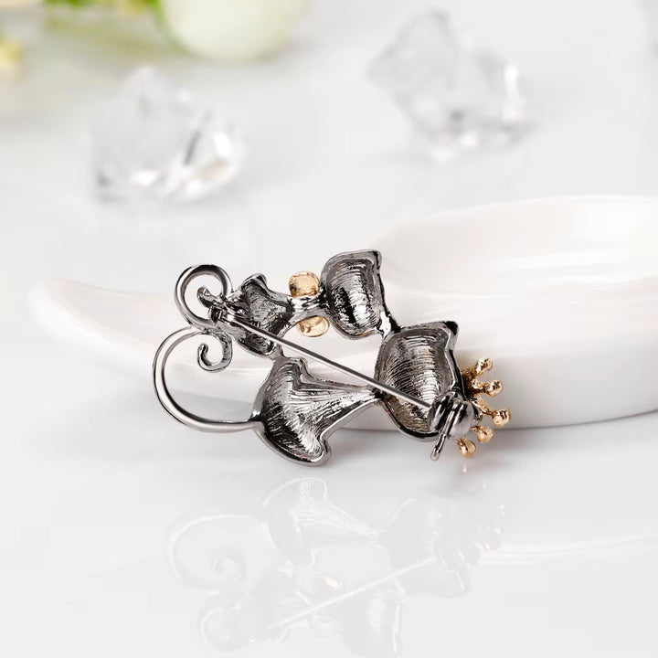 Back side of the brooches on a white surface
