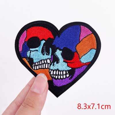 Colorful skull design patch held by a hand with size measurement on a white background