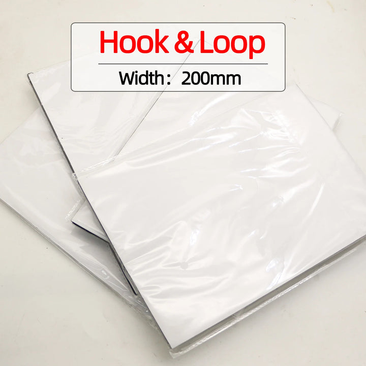 sheets of hook and loop material with a label indicating width on a white background