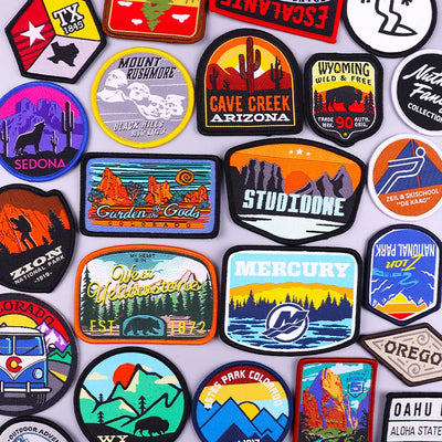 Collection of various colorful patches with different designs and text.