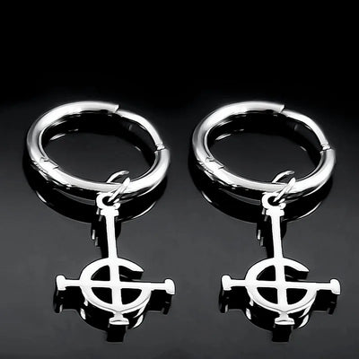 Pair of silver hoop earrings with a central circular design on a black background