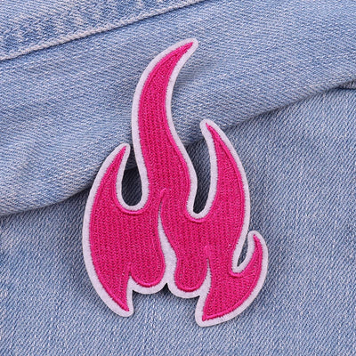 Pink flame patch on a denim background