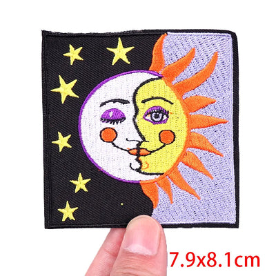 Patch with sun and moon design held by a hand, with dimensions displayed.