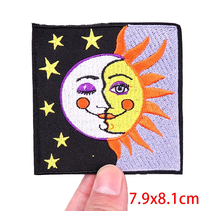 Patch with sun and moon design held by a hand, with dimensions displayed.