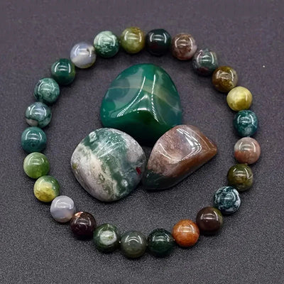 Multicolored beaded bracelet with large stones on a dark surface