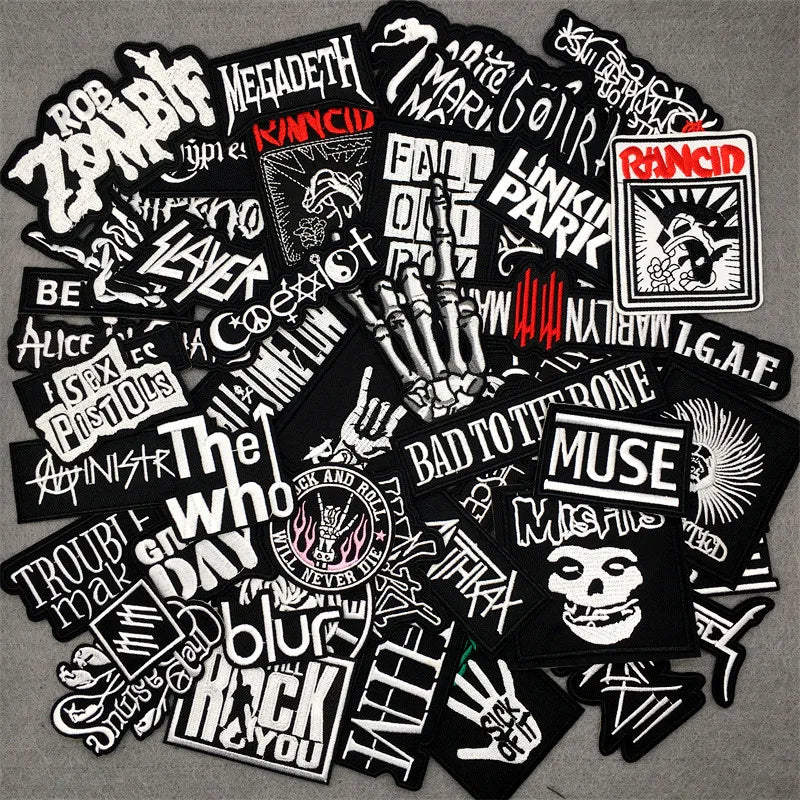 Collection of music band stickers on a gray background
