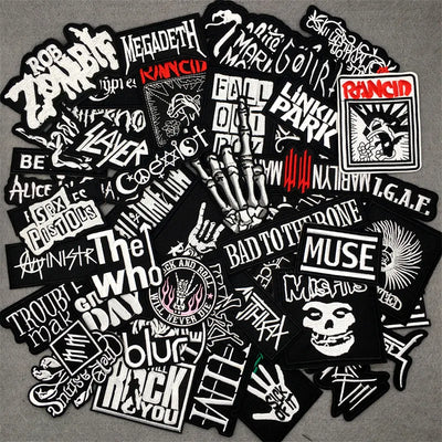 Collection of music band stickers on a gray background