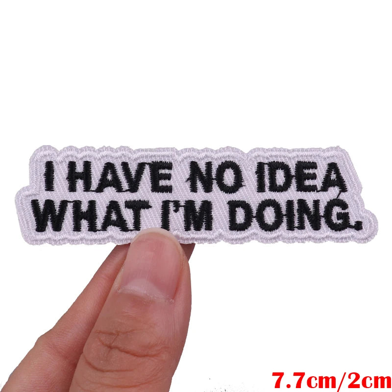 Text patch with 'I HAVE NO IDEA WHAT I'M DOING.' held by a hand on a white background