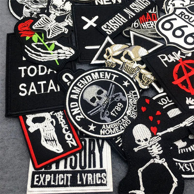 Collection of various patches with different designs on a gray background