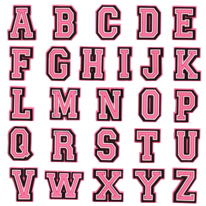 shoe charms Pink letters of the alphabet with black outlines on a white background