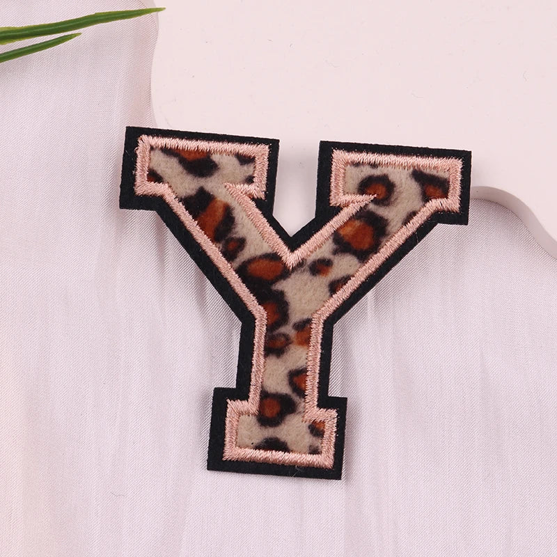 Leopard print letter 'Y' patch on a white background