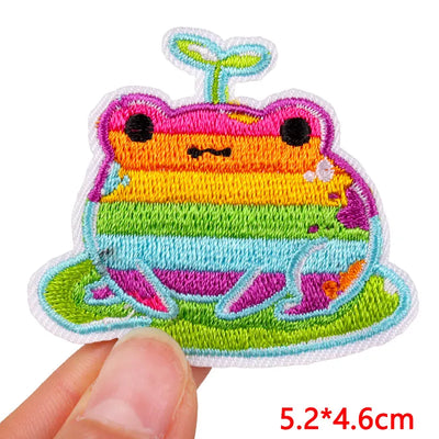 Colorful embroidered patch of a cartoon character on a white background