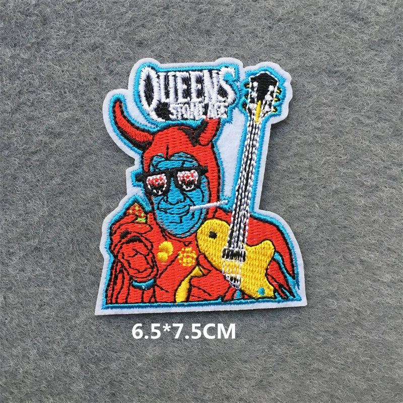 Colorful patch with a character holding a guitar on a gray background