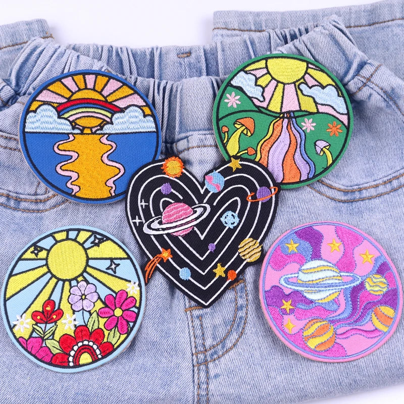 Colorful embroidered patches on a denim background