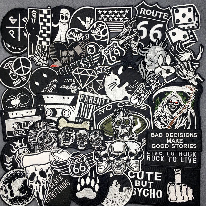 Collection of various black and white stickers with different designs on a dark background