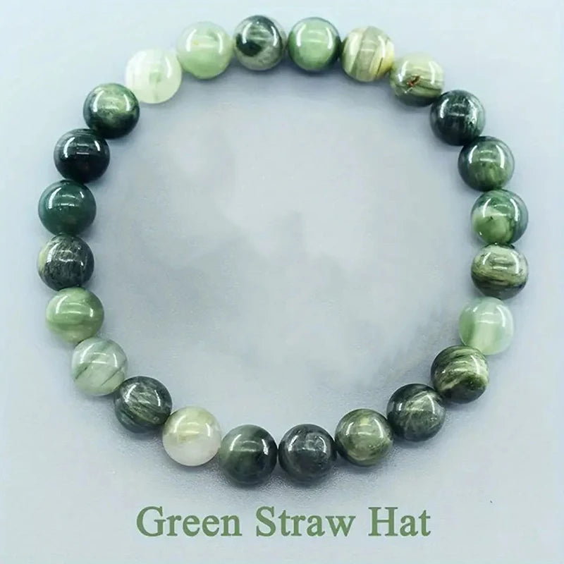 Green beaded bracelet on a white background with &