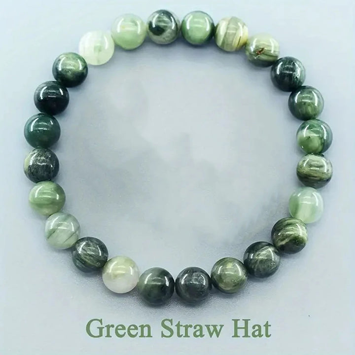Green beaded bracelet on a white background with &