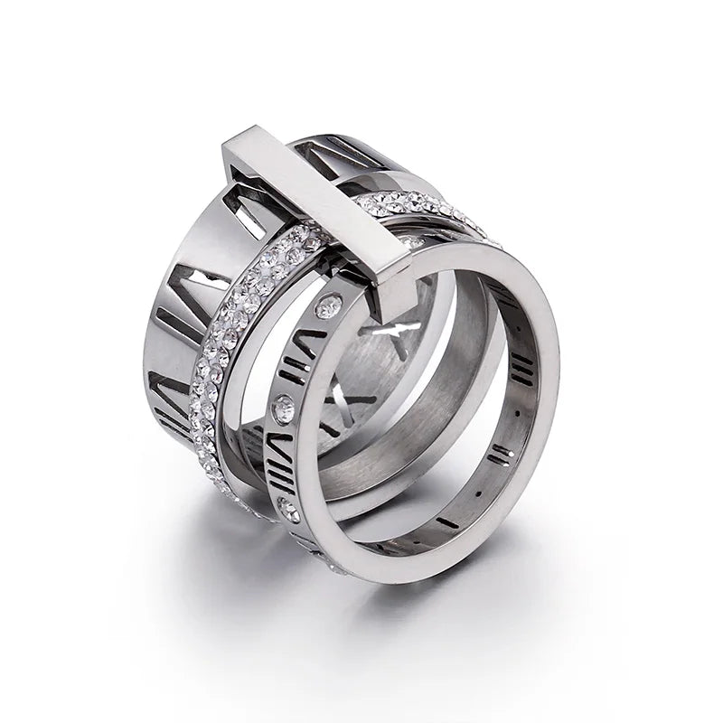 Silver ring with diamond accents on a white background