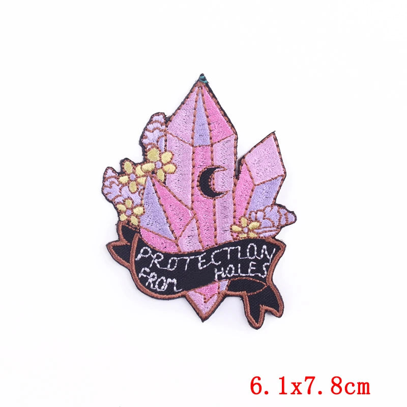 Decorative patch with crystals and text on a white background