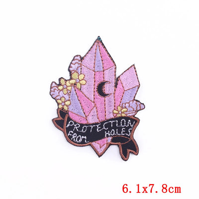 Decorative patch with crystals and text on a white background