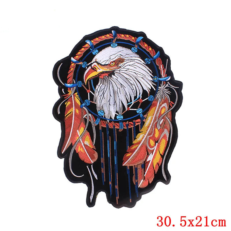 Decorative patch with an eagle design and feathers on a white background, branded 'Prajna'.
