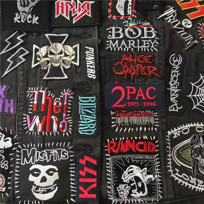 Collection of various music-themed patches on a black background