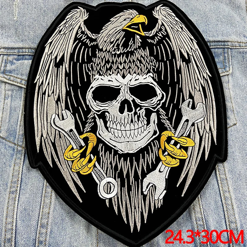 Skull with wings and crossed swords on a denim background