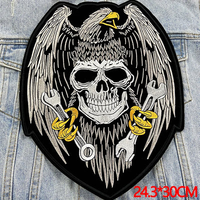 Skull with wings and crossed swords on a denim background