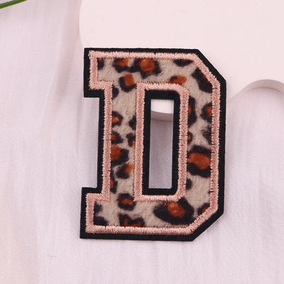 Leopard print letter 'D' patch on a white background