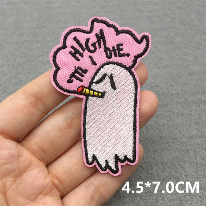Embroidered patch of a ghost smoking with &