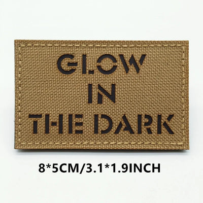 Rectangular patch with 'GLOW IN THE DARK' text on a brown background